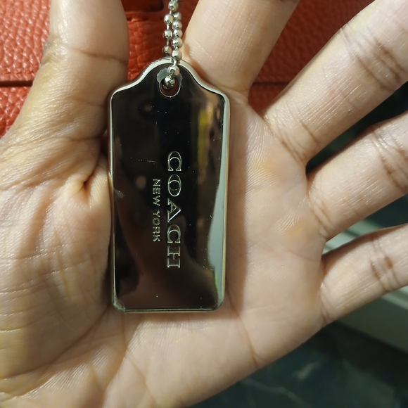 Coach Tyler Tote in an orange/red shade of pebbled leather. - Picture 4 of 16